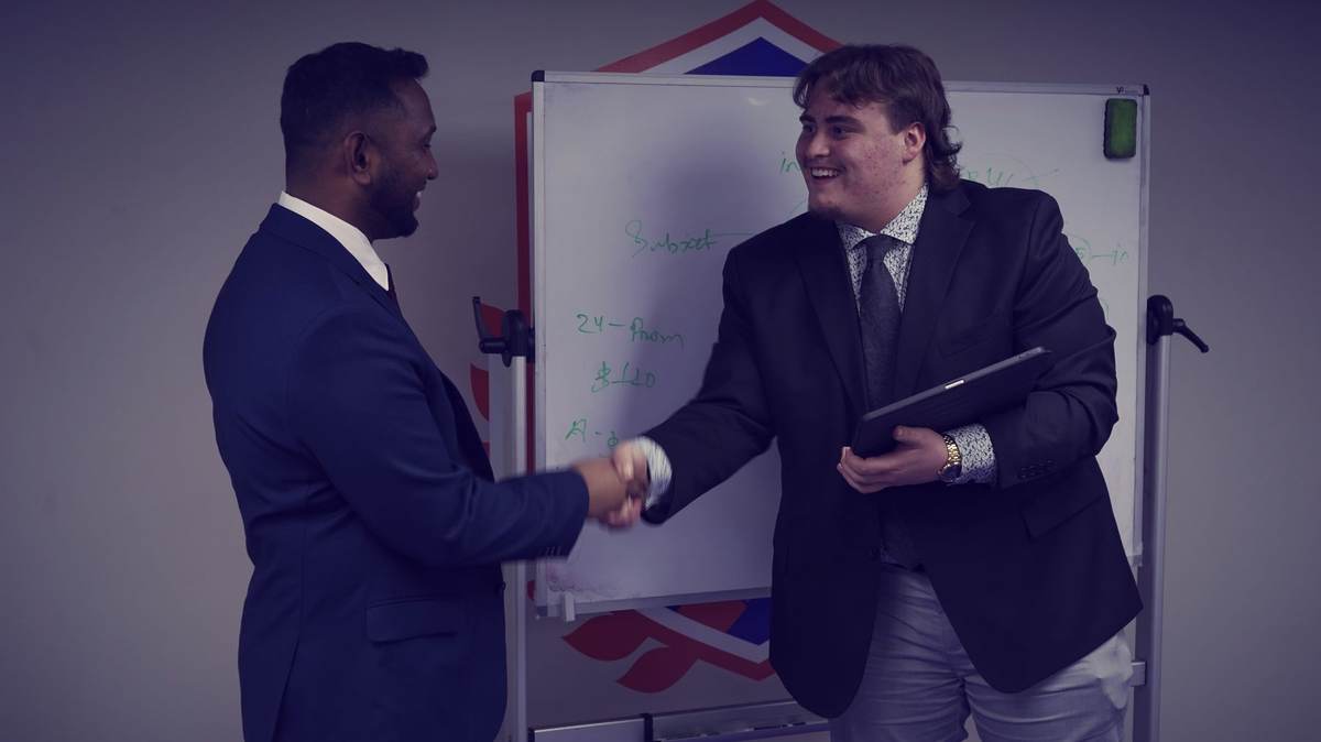 A SocialRise rep closing a deal at the whiteboard